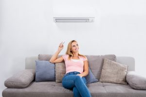 woman-operating-ductless-system